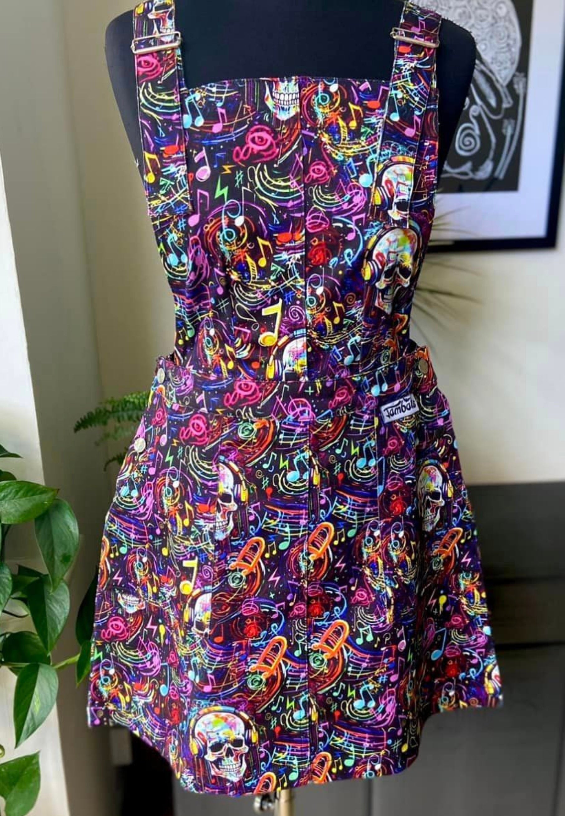 Dead Beats Pinafore. Graffiti Music Skulls Pinafore on mannequin. 