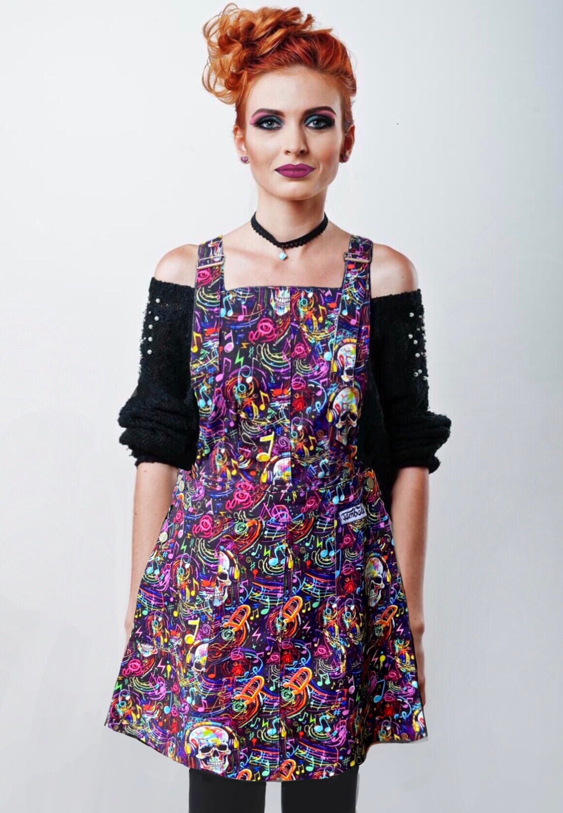 Woman Wearing Dead Beats Pinafore. Graffiti Music Skulls Pinafore