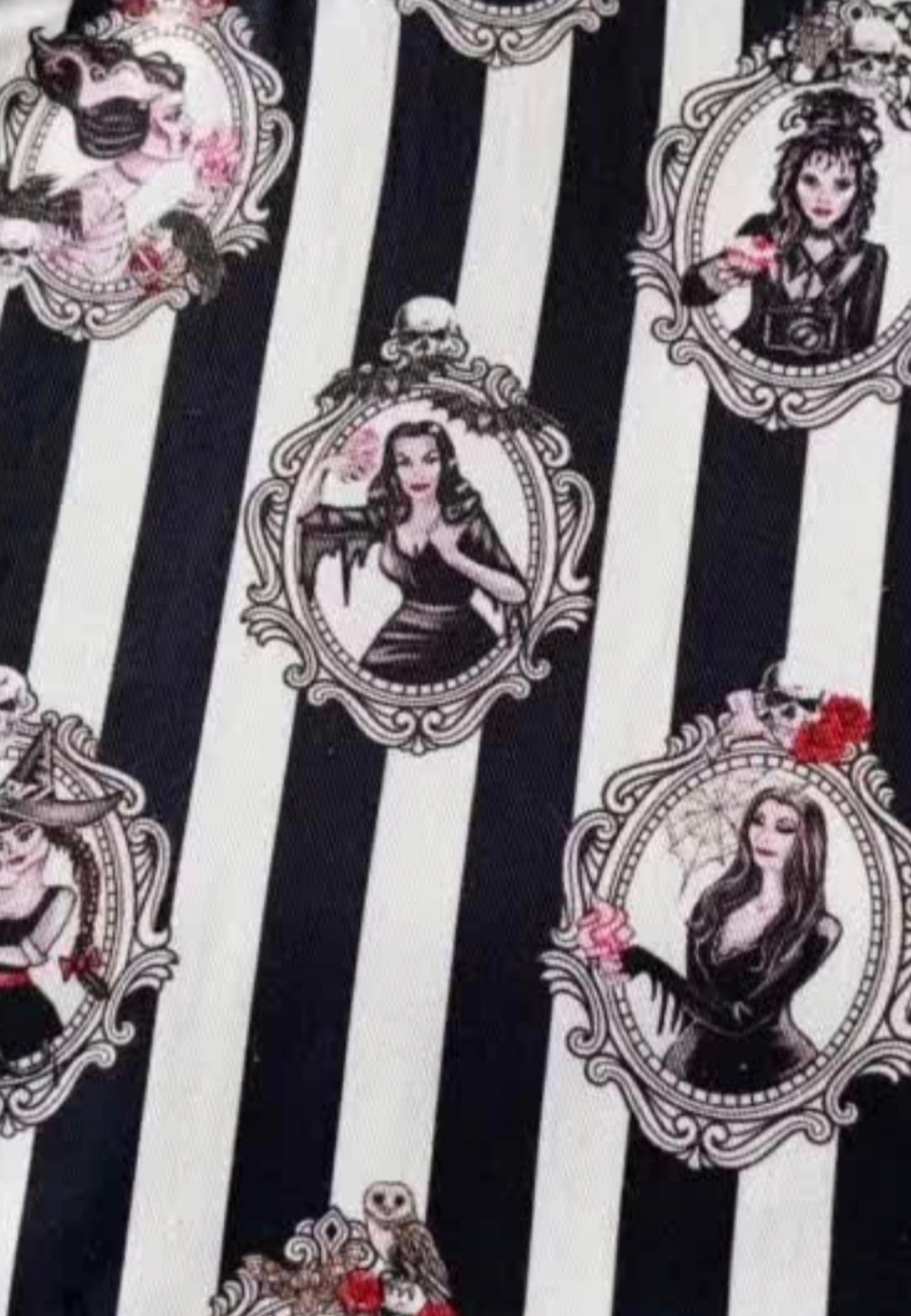 Patterned fabric with black and white stripes and gothic style illustrations of the iconic women ghouls. 