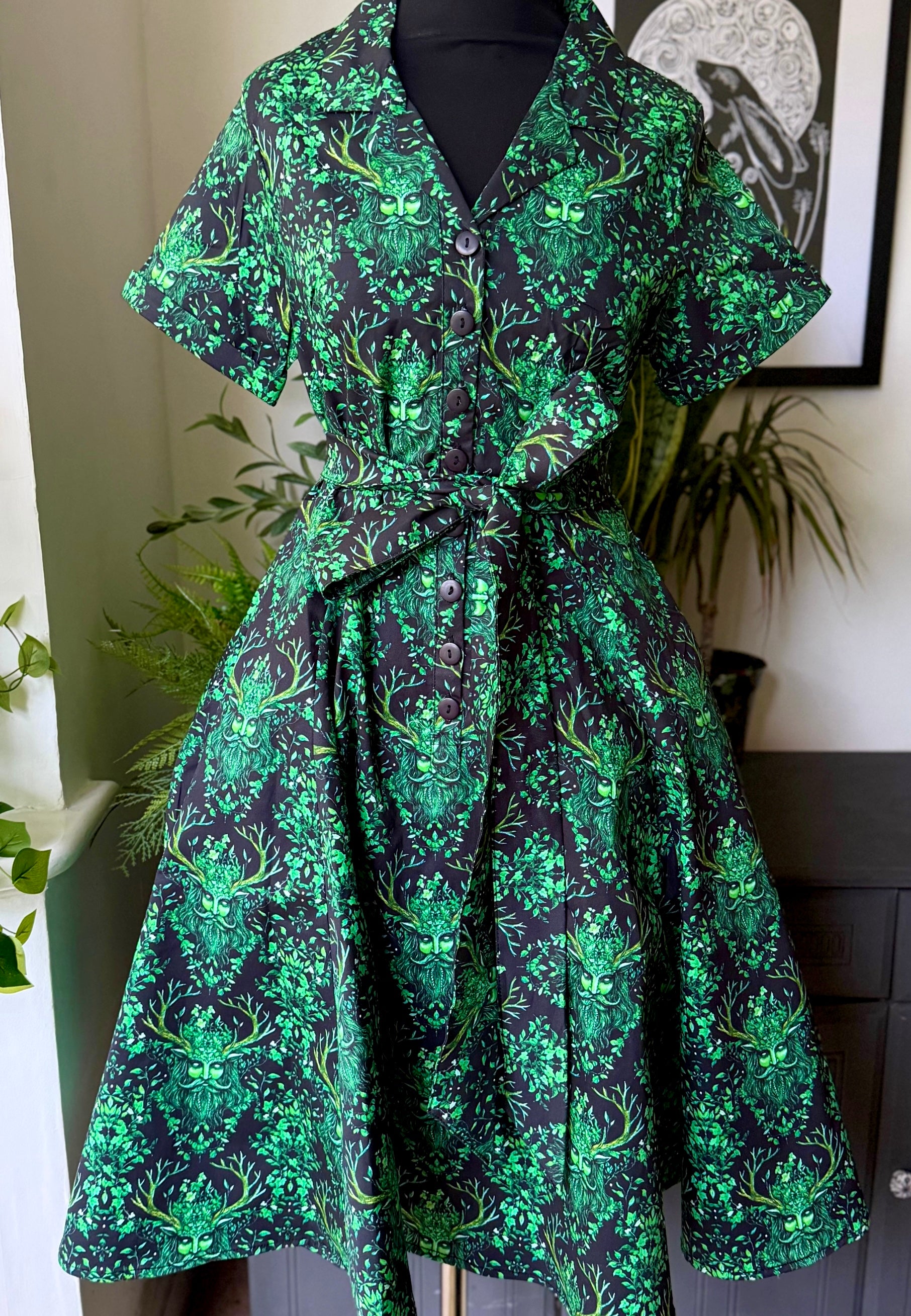 Mannequin photo of a Green Man print shirt dress. Studio photo. Mystical witchy Cottagecore dress. 