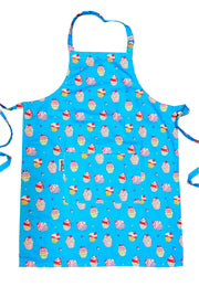 Vibrant blue apron with a print of kawaii cupcakes. Apron on a white background. 