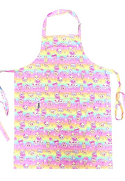 Colorful pastel rainbow apron with kawaii character pattern of cupcakes and sweet treats. Apron is on a white background