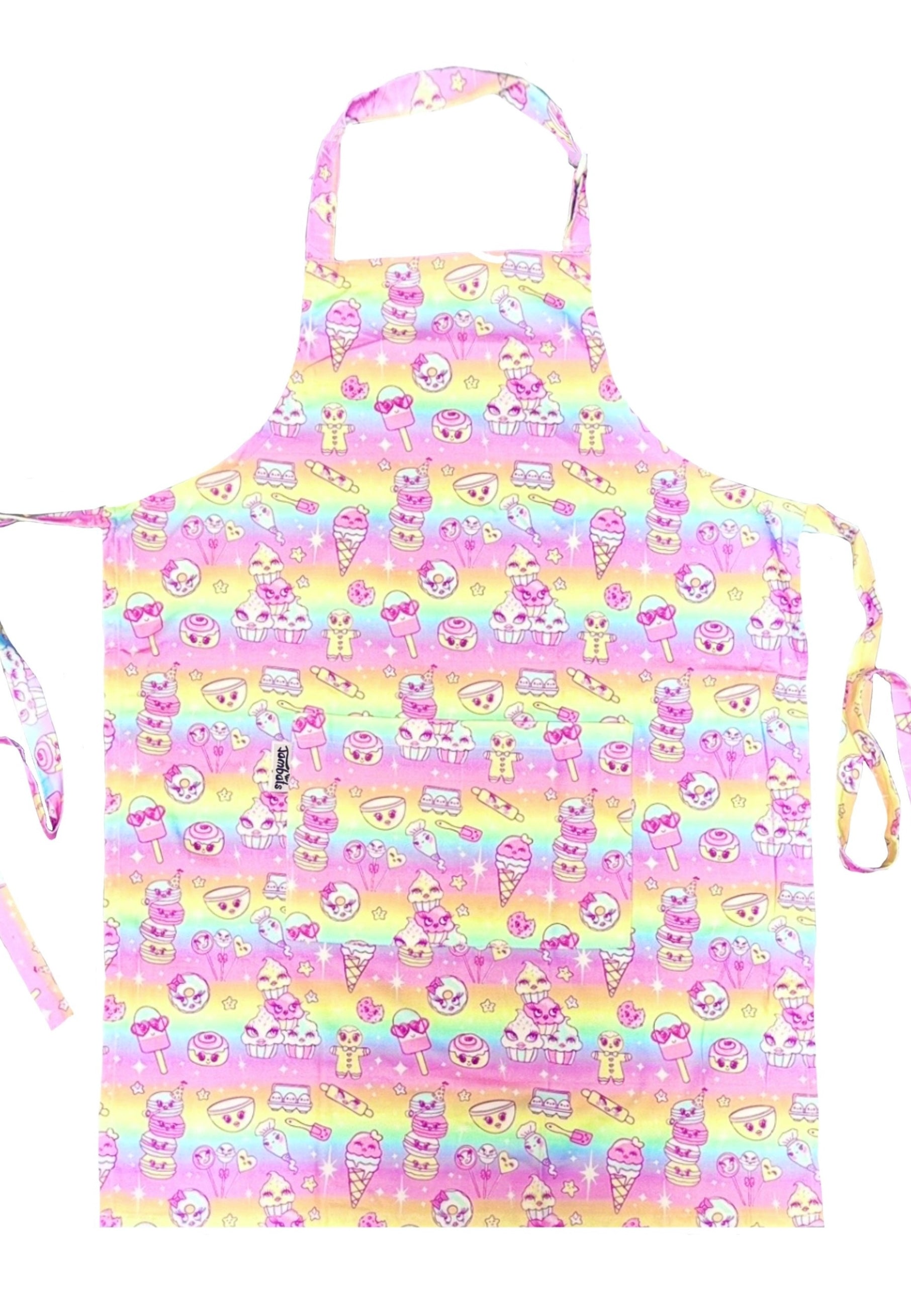 Colorful pastel rainbow apron with kawaii character pattern of cupcakes and sweet treats. Apron is on a white background
