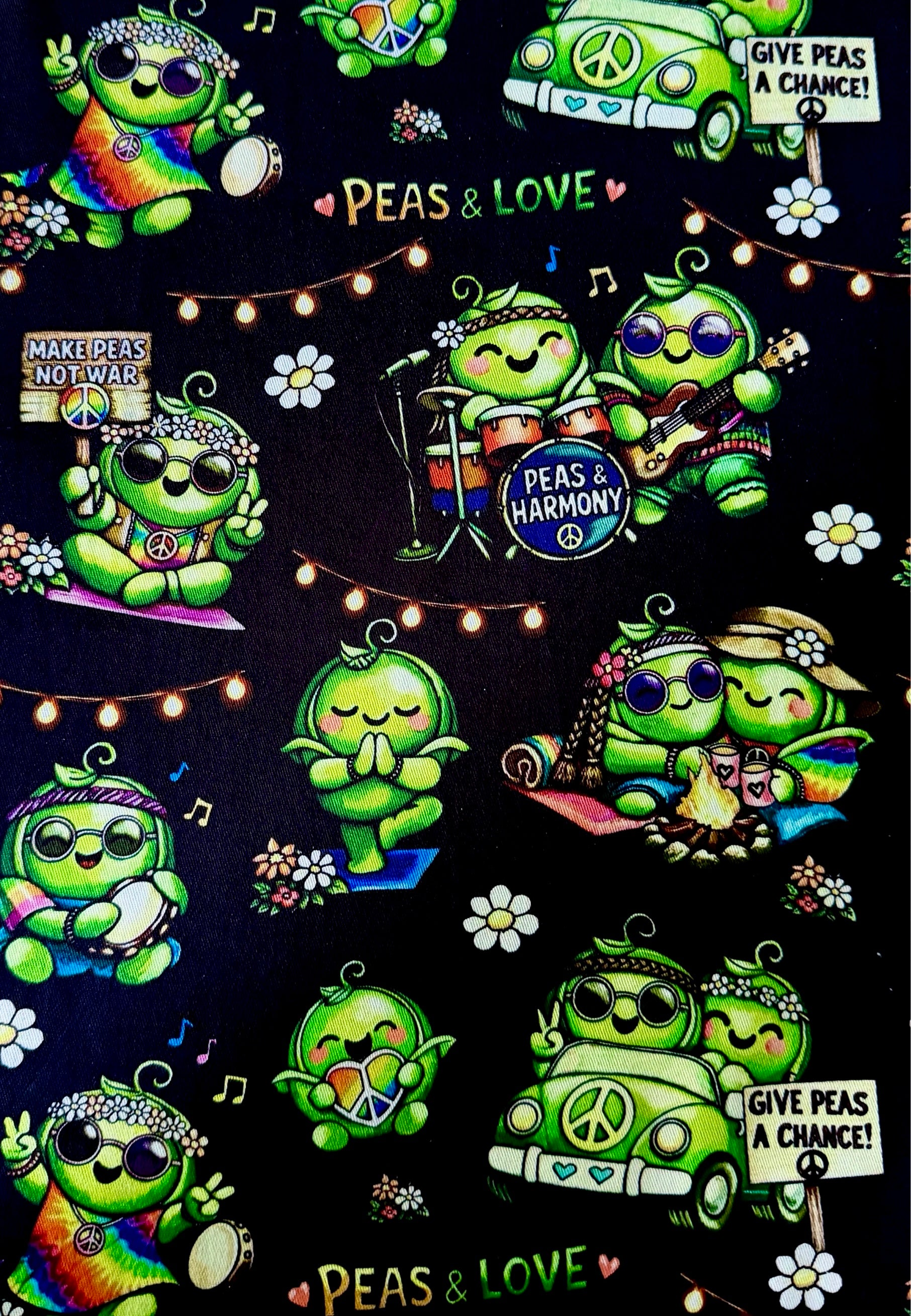 Close up of fabric. Green hippie peas at a Peas festival holding up banners like ‘Give Peas a Chance’
