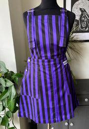 Purple and black striped pinafore dress on a mannequin. Jambats. 