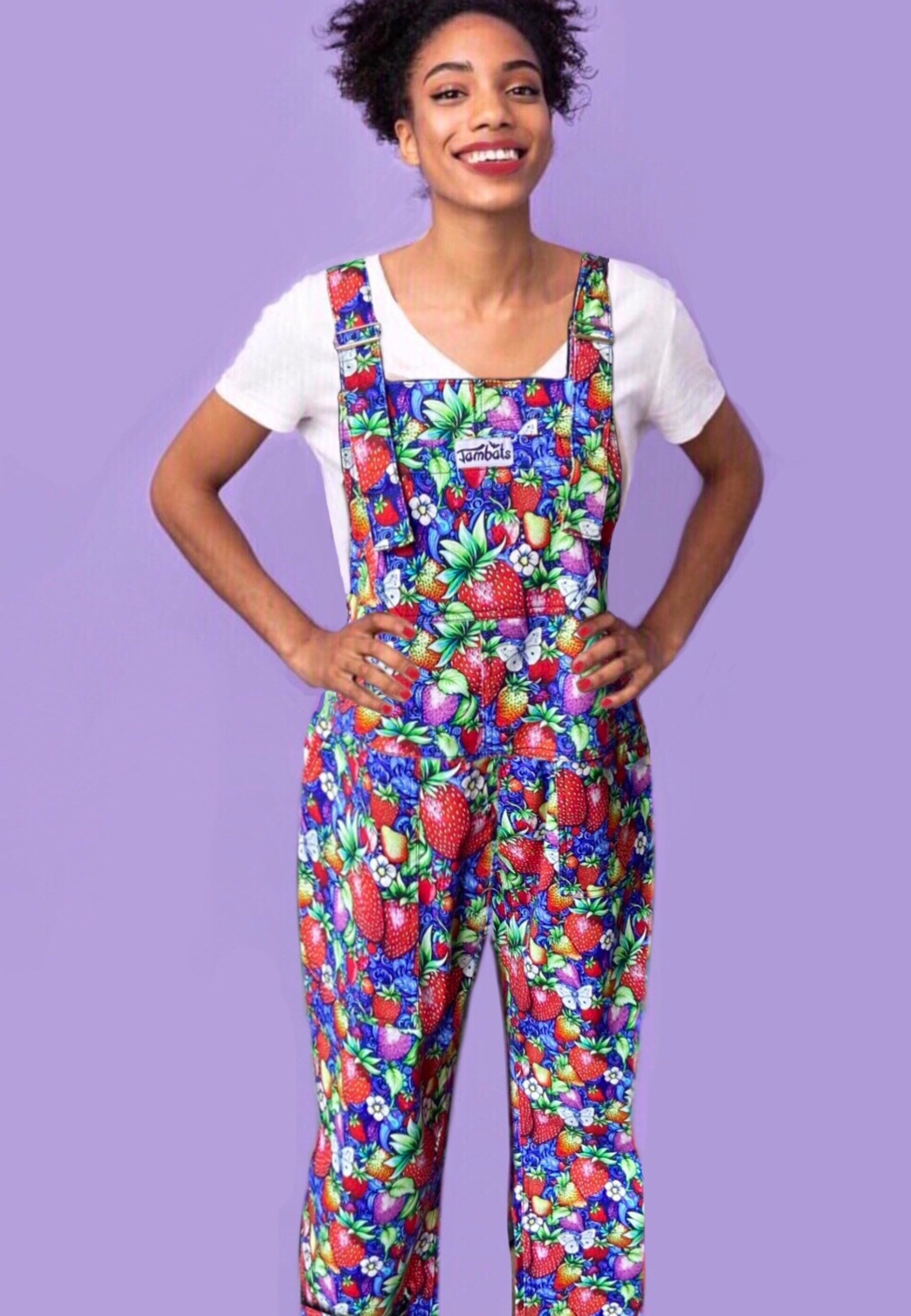 Woman wearing vibrant Strawberry Fields Dungarees 