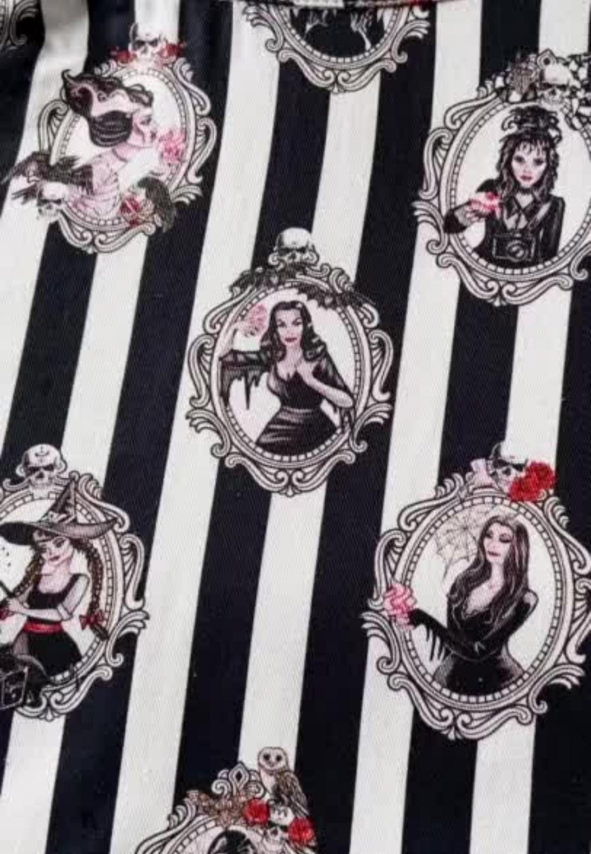 A close up of a spooky black and white stripe fabric print with all the famous female ghouls on 